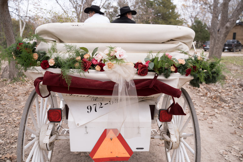 floral garland on horse carriage